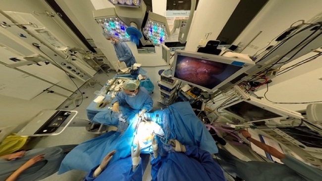 Surgeons performing surgery in hospital